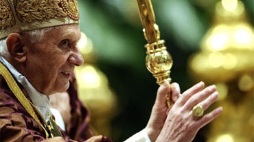 Pope Benedict XVI waves to Mass attendees after a Vespers prayer in St. Peter's Basilica at the Vatican Dec. 16, 2010. Pope Benedict XVI the same day called for "Christ's followers" to be defended in Africa, Asia and the Middle East and warned governments 