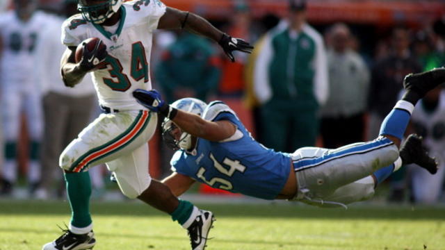 Anthony Fasano (80) of the Miami Dolphins is stopped short of a