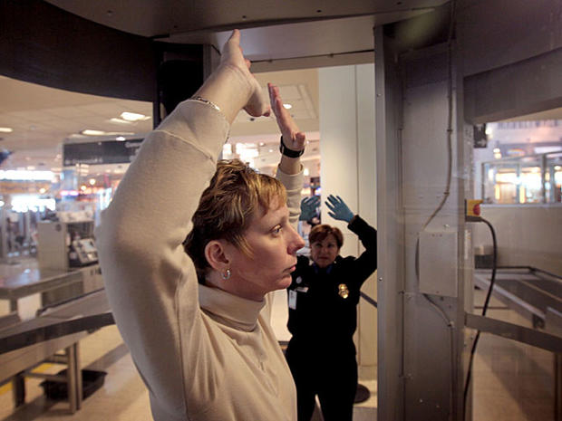 :  CHICAGO, IL - DECEMBER 15: Transportation Security Administration (TSA) agents Leigh Bauman (L) and Robin Blum demonstrate a full body scanner at Midway Airport December 15, 2010 in Chicago, Illinois. TSA began using the new scanners at the airport for 