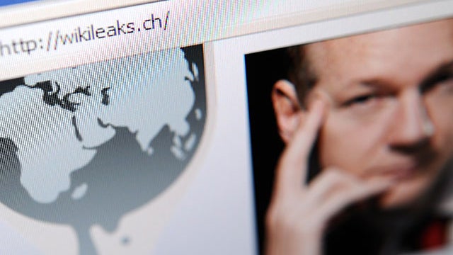 The homepage of Wikileaks.ch with a picture of its founder Julian Assange is seen on a computer screen on December 4, 2010 in Lausanne. WikiLeaks was battling to stay online after Sweden issued a new arrest warrant for its elusive boss Julian Assange, whi 