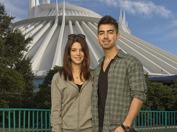 "Twilight" star Ashley Greene, left, poses with actor/singer Joe Jonas of the pop-rock trio Jonas Brothers, in front of Space Mountain at the Magic Kingdom in Lake Buena Vista, Fla., Wednesday, Dec. 29, 2010. 