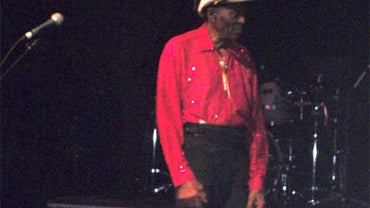 American guitarist, singer and songwriter, Chuck Berry walks off stage after being examined by ambulance medics and thanking the crowd at a show in Chicago Sat. Jan. 1, 2011. 