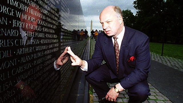 May 17, 1994, John Wheeler III touches the name of a friend engraved in the Vietnam Veterans Memorial in Washington. 