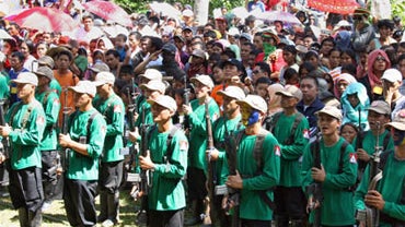New People's Army (NPA) guerrillas attending a ceremony to celebrate the 42nd founding anniversary of the Communist Party of the Philippines, at a remote village in the southern island of Mindanao, Dec. 26, 2010 (Getty Images) 