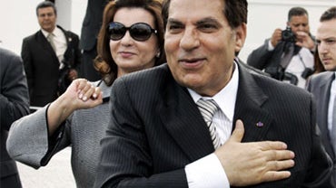 In this Oct.25 2009 file photo, Tunisian President Zine El Abidine Ben Ali and his wife Leila salute their supporters in the affluent Carthage neighborhood next to the capital, Tunis. Tunisians cheering a new era after the end of President Zine El Abidine 