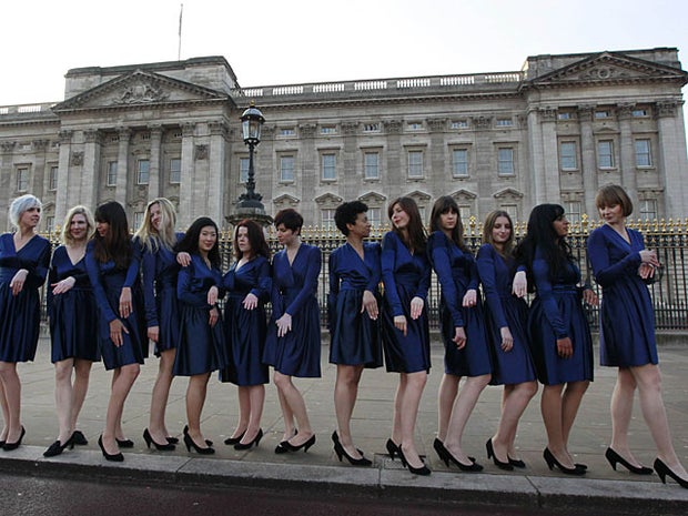 group of students from the Royal College of Art pose for photographs wearing Kate Middleton style engagement outfits they made themselves and engagement rings outside Buckingham Palace in London, Wednesday, Jan. 19, 2011. The group carried out the stunt for fun ahead of the wedding of Britain's Prince William and Kate Middleton in 100 days time on April 29, 2011. (AP Photo/Matt Dunham) 