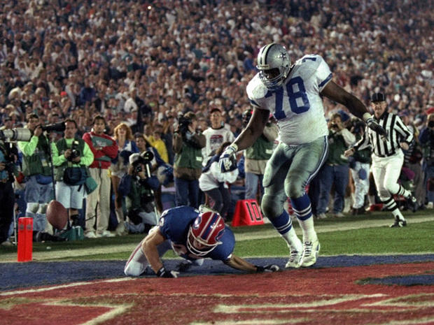 Don Beebe of the Bills forces a fumble on defensive tackle Leon Lett of the Cowboys  