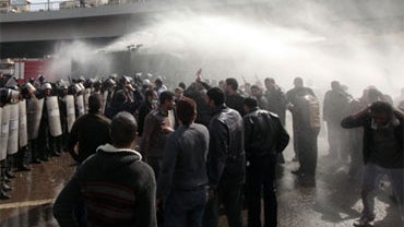 Egyptian anti-riot policemen use water canons against protesters in Cairo, Egypt, Friday, Jan. 28, 2011. 