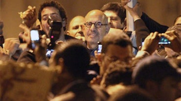 Egyptian leading dissident Mohamed ElBaradei and former UN nuclear watchdog Chief (C) attends a demonstration in al-Tahrir square in central in Cairo, on January 30, 2011,  