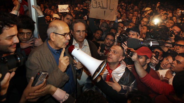 Mohamed ElBaradei waves to supporters in Tahrir Square 