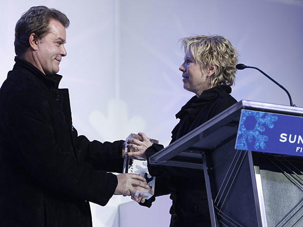 Actor Ray Liotta, left, presents director Cindy Meehl with the Audience Award: U.S. Documentary for "Buck" during the 2011 Sundance Film Festival Awards Ceremony in Park City, Utah, on Saturday, Jan. 29, 2011. (AP Photo/Danny Moloshok) 