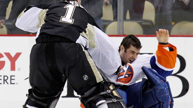 Pittsburgh Penguins goalie Brent Johnson (1) knocks New York Islanders goalie Rick DiPietro 