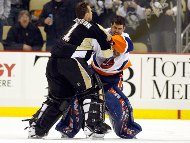 Brent Johnson  gets in a left against Rick DiPietro 