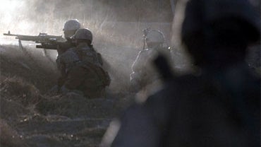 US Marines from 1st Battalion, 8th Marines fire at alleged Taliban fighers outside new Mirage base, on the south of Musa Qala District, Helmand province on February 4, 2011. US-led NATO troops are under a deadline across Afghanistan to train local forces  
