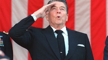 President Ronald Reagan salutes during the Pledge Of Allegiance at a Veterans Day ceremony at Arlington National Cemetery, November 11, 1988.  