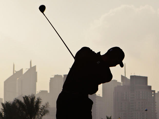 Tiger Woods plays a shot at the Dubai Desert Classic 