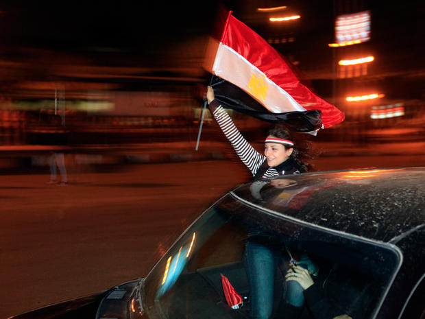 An Egyptian woman celebrates after President Hosni Mubarak resigned  