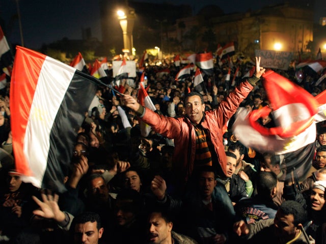 Egyptians celebrate the news of the resignation of President Mubarak 