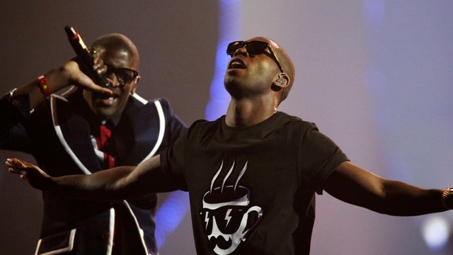 Tinie Tempah, right, performs at Brit Awards 