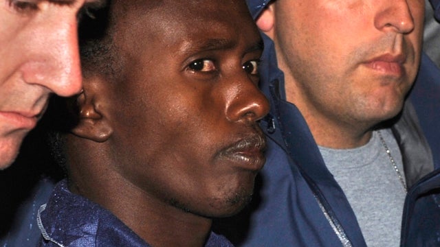 FBI agents escort Abdiwali Abdiqadir Muse 