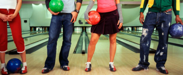 People Holding Bowling Balls 