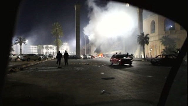  fire burns in a street in the Libyan capital Tripoli in the early hours Feb. 22, 2011 in this image taken from TV. 