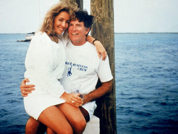 American politician Gary Hart sits on a dock with Donna Rice on his lap, 1987.  