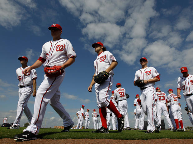 Nationals pitchers make their way to a practice field 