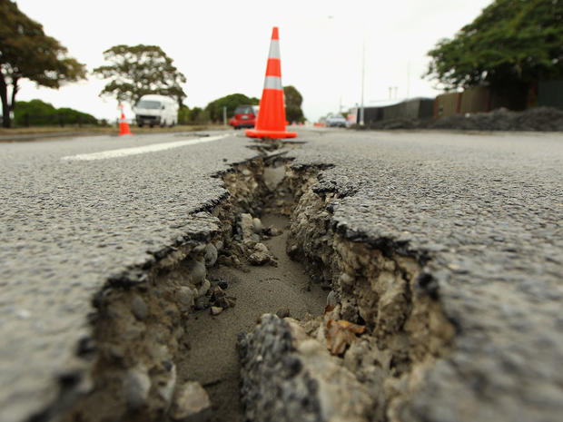 A large crack splits a road in the suburb of New Brighton in Christchurch 