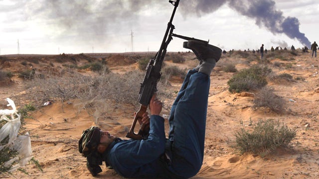 Libya opposition fires on Qaddafi jets 