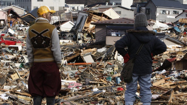 Residents survey tsunami damage in Miyagi Prefecture, Japan 