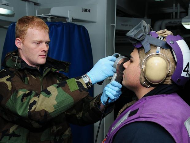Navy personnel check for radiation levels in operations off the coast of Japan, March 18, 2011. 