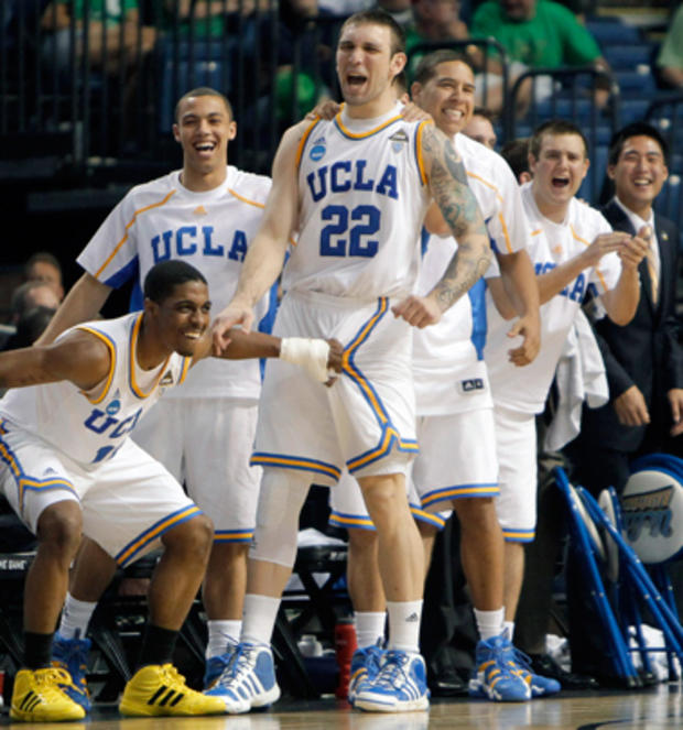 UCLA players celebrate from the bench 
