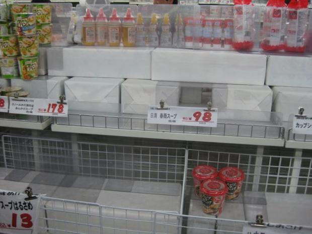 Empty shelves in Tokyo after a run on groceries by a nervous public. 