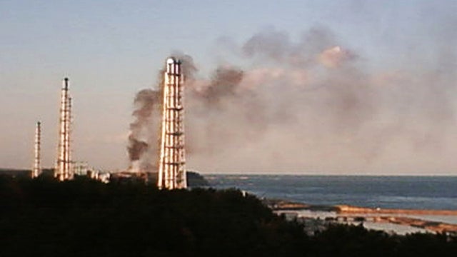 smoke billows from the crippled Fukushima Dai-ichi nuclear power plant  