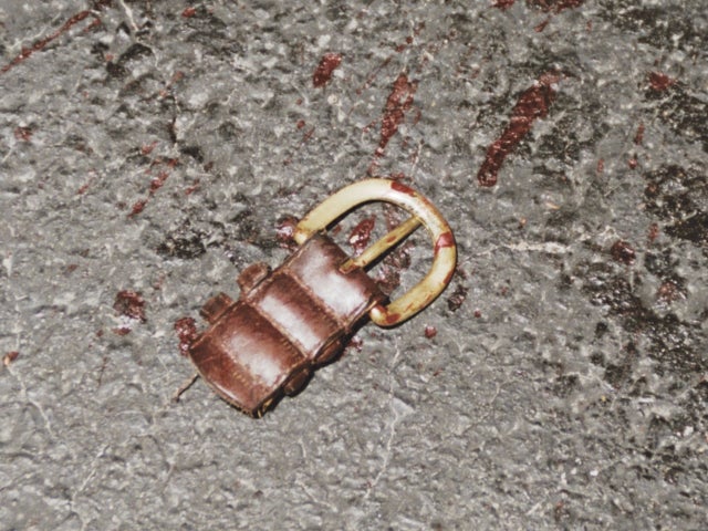 Kent Heitholt's belt buckle and a fragment of the belt at the crime scene 