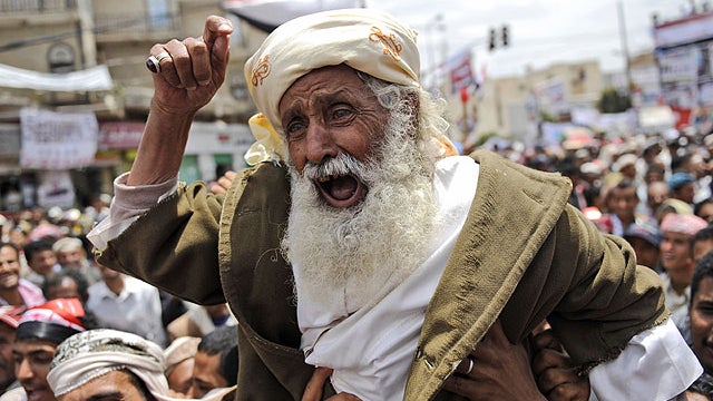 An elderly anti-government protestor reacts during a demonstration demanding the resignation of Yemeni President Ali Abdullah Saleh, in Sanaa,Yemen, March 26, 2011.  