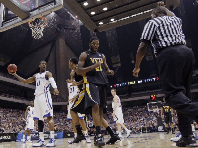 Virginia Commonwealth's Jamie Skeen (21) reacts to being fouled 