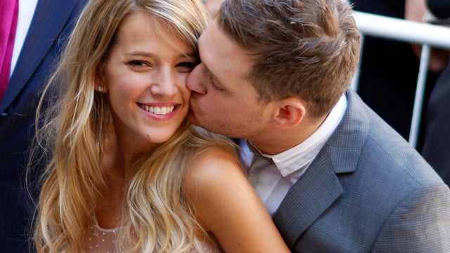 Michael Buble kisses his bride, Luisana Lopilato after their civil ceremony in  Buenos Aires. 