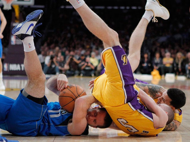 Jose Juan Barea fights for a loose ball 