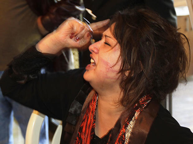 Iman Al-Obeidi is seen in Tripoli in this March 26, 2011 file photo, after storming into a hotel's breakfast room to show her wounds to foreign media. 