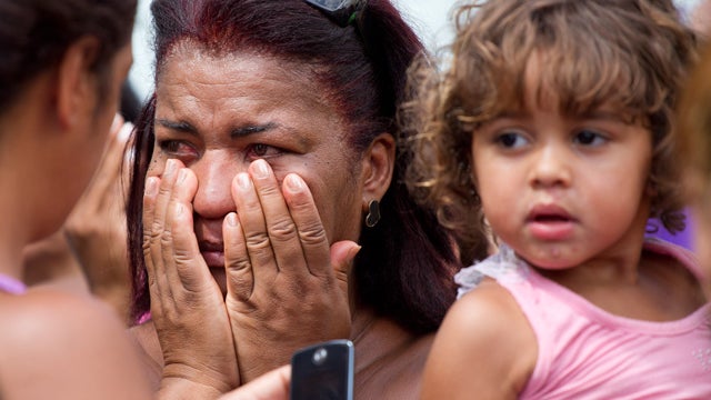 A woman reacts outside a school after a shooting at the school in Rio de Janeiro 