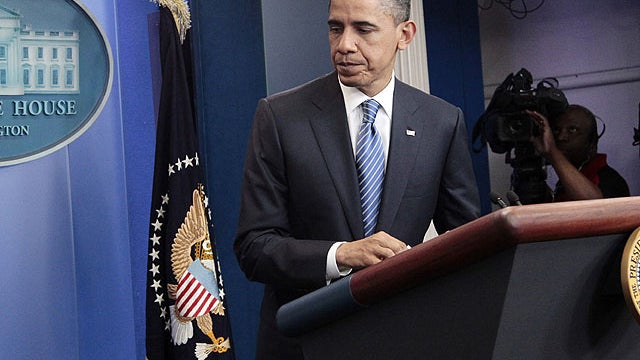 President Barack Obama walks away from the podium after speaking to reporters at the White House in Washington after meeting with House Speaker John Boehner, R-Ohio, and Senate Majority Leader Harry Reid, D-Nev., regarding the budget and possible governme 