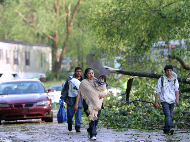 Stony Brook North Mobile Home residents evacuate from the property after sever tornado passed through the area Saturday, April 16, 2011 in Raleigh, N.C.  