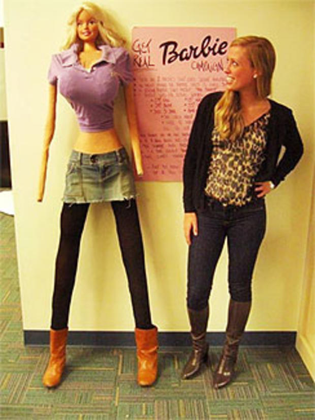 Galia Slayen stands with her life-sized Barbie 
