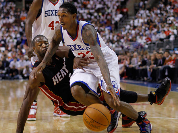 Dwyane Wade gets a hand on 76ers' Lou Williams 