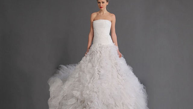  Douglas Hannant gown features 12-foot tulle train.  Princess Diana's train was 25-feet long. 
