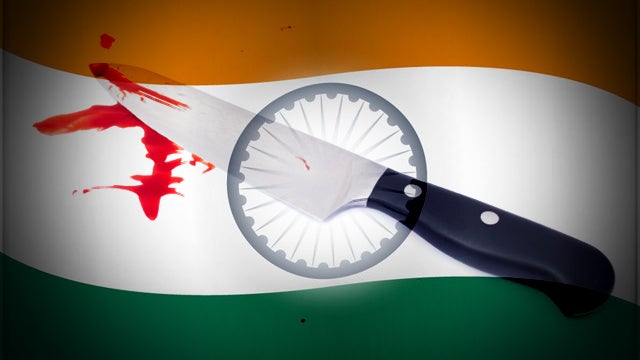 Large knife with blood stains over flag of India 