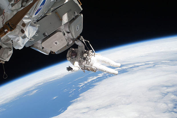 Mission specialist Nicholas Patrick participates in the third and final spacewalk of STS-130 on February 17, 2010 during construction of the International Space Station, including removing insulation blankets and launch restraint bolts from each of the Cu 