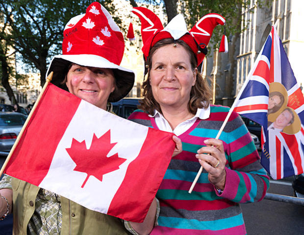 Anne Dent from London and Elaine Bathurst from Canada pose for a portrait in front of Westminster Abbey in advance of the Royal Wedding on April 27, 2011, in London.  